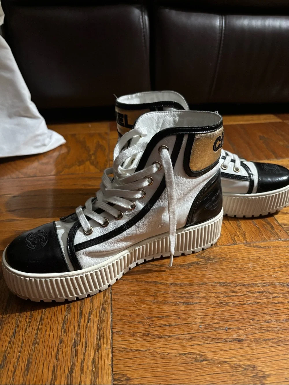 CHANEL White and Black Logo High-Top Sneakers